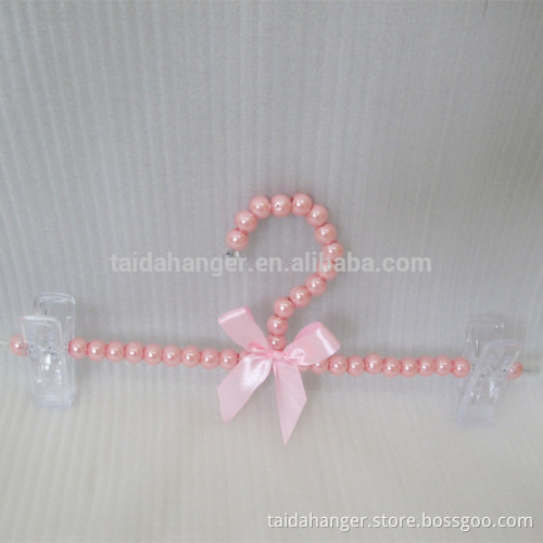 white pink pearl pants hangers with pretty bows small clips hangers for fashionable dress trousers